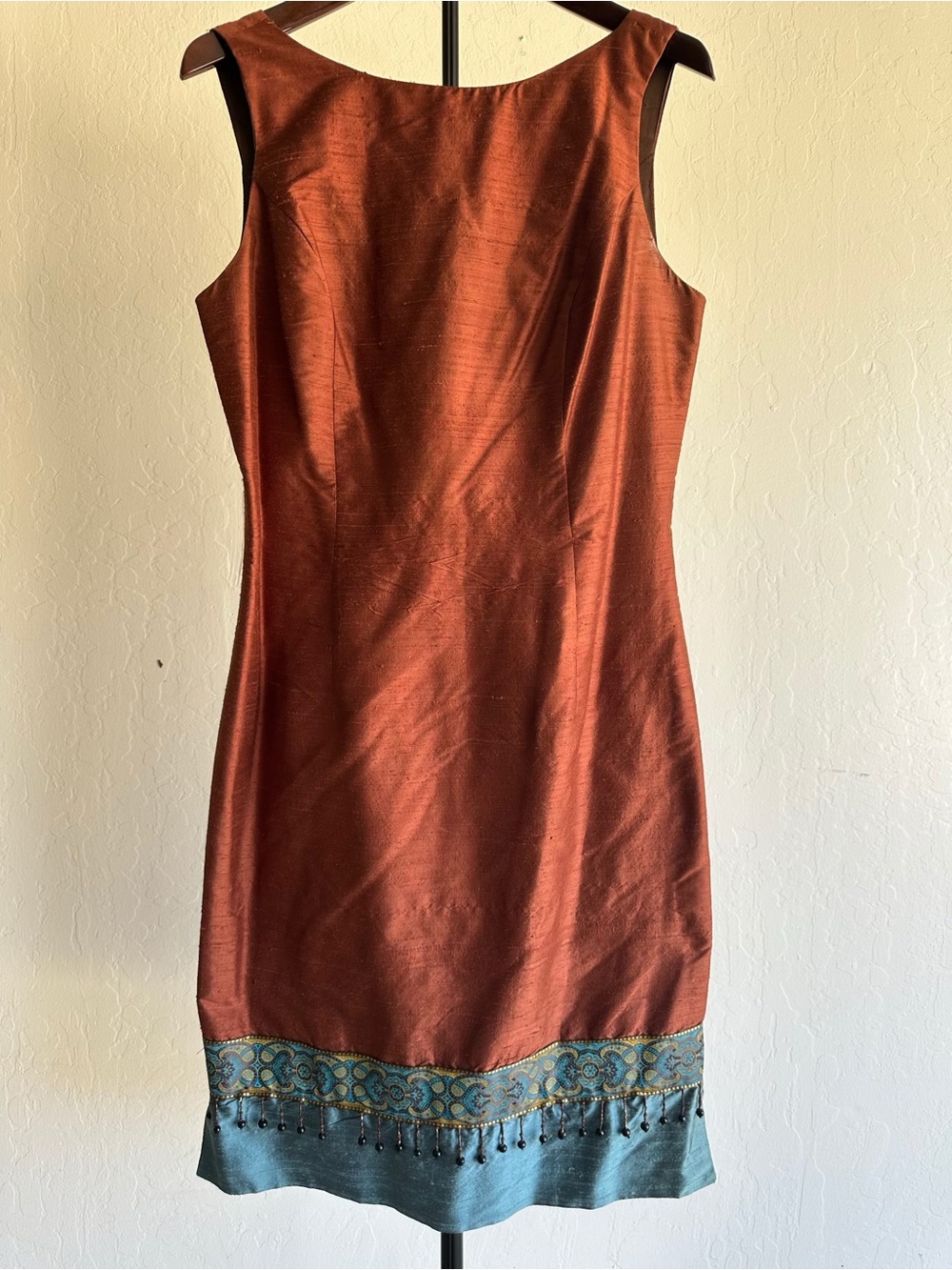 Rust Sleeveless Midi Dress with Teal Embroidered Hem